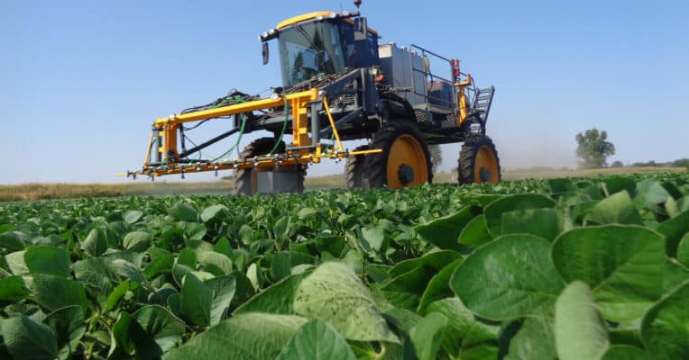 sprayer in soybean field applying micronutrients